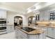 Gourmet kitchen featuring a center island, modern appliances, and ample counter space at 13670 N 85Th Pl, Scottsdale, AZ 85260