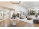 Bright and airy living room showcasing an open floor plan, hardwood floors, and seamless flow into other spaces at 13670 N 85Th Pl, Scottsdale, AZ 85260