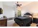 Bedroom with neutral colors, ceiling fan, and large windows providing natural light at 13670 N 85Th Pl, Scottsdale, AZ 85260