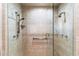 Walk-in shower featuring dual shower heads and marble tile walls at 13670 N 85Th Pl, Scottsdale, AZ 85260