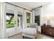 Cozy sitting room with floor to ceiling windows and doors providing ample natural light at 13670 N 85Th Pl, Scottsdale, AZ 85260