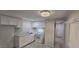 Bright kitchen with white cabinets and modern appliances offers a clean look at 1402 S 76Th Pl, Mesa, AZ 85209