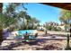 Enjoy a refreshing swim in the pool of this backyard featuring lush landscaping and ample patio space at 14460 N 100Th Way, Scottsdale, AZ 85260