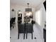 Dining room featuring tile floors and a glass top table with seating for eight at 14460 N 100Th Way, Scottsdale, AZ 85260