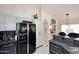 Bright kitchen with granite counters and stainless steel fridge at 14460 N 100Th Way, Scottsdale, AZ 85260