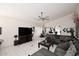 Bright living room with white walls, tile floors, and a comfortable leather sofa at 14460 N 100Th Way, Scottsdale, AZ 85260