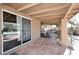 Outdoor patio with tile flooring, seating area, and view of the pool at 14460 N 100Th Way, Scottsdale, AZ 85260