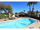 The pool area offers lush landscaping, plenty of seating, and a refreshing escape from the Arizona heat at 14460 N 100Th Way, Scottsdale, AZ 85260