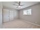 Neutrally decorated bedroom with a ceiling fan providing a serene and adaptable space at 15032 N 24Th N Pl, Phoenix, AZ 85032