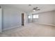 Clean bedroom featuring neutral colors, a ceiling fan and window for natural light, offering a quiet space at 15032 N 24Th N Pl, Phoenix, AZ 85032