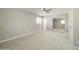 A bright bedroom with a ceiling fan and closet offering a simple, yet practical appeal at 15032 N 24Th N Pl, Phoenix, AZ 85032