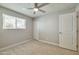 Cozy bedroom with neutral colors and a ceiling fan, offering a comfortable and inviting space at 15032 N 24Th N Pl, Phoenix, AZ 85032