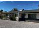 Charming single-story home with rock landscaping and blue door at 15032 N 24Th N Pl, Phoenix, AZ 85032