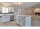 Well-lit kitchen open to living area with stainless appliances and island at 15032 N 24Th N Pl, Phoenix, AZ 85032