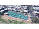 Aerial view of the pickleball courts with blue and green surface, set among homes and desert landscape at 17200 W Bell Rd # 357, Surprise, AZ 85374