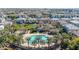 Aerial view of the community pool, clubhouse and surrounding homes in a beautiful neighborhood at 1724 E Bridgeport Pkwy, Gilbert, AZ 85295