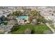 Aerial view of the community pool, clubhouse, and surrounding homes in a well-maintained neighborhood at 1724 E Bridgeport Pkwy, Gilbert, AZ 85295