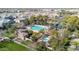 Community aerial view showing the pool, pool, clubhouse, and surrounding homes in a well-kept neighborhood at 1724 E Bridgeport Pkwy, Gilbert, AZ 85295