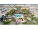 Aerial view of a community featuring a pool, green spaces, and well-maintained homes at 1724 E Bridgeport Pkwy, Gilbert, AZ 85295