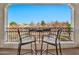 Relaxing balcony with table and chairs overlooking picturesque water view at 1724 E Bridgeport Pkwy, Gilbert, AZ 85295