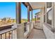 Charming balcony with stone pillars providing delightful views of the community at 1724 E Bridgeport Pkwy, Gilbert, AZ 85295