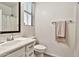 Cozy bathroom features a white vanity, neutral walls, and a window for natural lighting at 1724 E Bridgeport Pkwy, Gilbert, AZ 85295