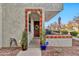 Inviting front entrance features a decorative tiled archway and charming wooden door with a wreath at 1724 E Bridgeport Pkwy, Gilbert, AZ 85295