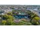 Aerial view of a community pond with water fountains and a wooden bridge at 1724 E Bridgeport Pkwy, Gilbert, AZ 85295