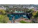 Aerial view of a community pond with water fountains, a bridge, and lush landscaping at 1724 E Bridgeport Pkwy, Gilbert, AZ 85295