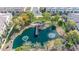 Aerial shot of a pond with a pier and fountains surrounded by community green space at 1724 E Bridgeport Pkwy, Gilbert, AZ 85295