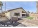 View of backyard, featuring patio, artificial grass, and mature palm trees at 1780 E Countrywalk Ln, Chandler, AZ 85225