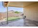 Cozy covered patio with tile flooring and a low-maintenance backyard, great for relaxing at 1780 E Countrywalk Ln, Chandler, AZ 85225