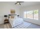 Serene bedroom featuring vaulted ceiling, neutral decor, and a large window at 1780 E Countrywalk Ln, Chandler, AZ 85225