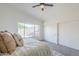 Bright bedroom featuring a neutral decor, vaulted ceiling, and large window at 1780 E Countrywalk Ln, Chandler, AZ 85225