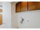 Utility room with upper cabinets and laundry hookups at 1780 E Countrywalk Ln, Chandler, AZ 85225