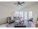 Bright living room featuring a vaulted ceiling, stylish furnishings, and access to the backyard at 1780 E Countrywalk Ln, Chandler, AZ 85225