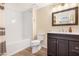 Updated bathroom with a shower-tub combination, dark vanity, and modern fixtures at 1825 W Ray Rd # 1148, Chandler, AZ 85224