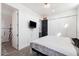 This bedroom features neutral color palette, adjoining bath, and large closet at 201 S Greenfield Rd, Mesa, AZ 85206