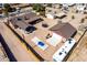 Aerial view of backyard with detached garage, covered patio, trampoline and boat at 2031 S Cactus Rd, Apache Junction, AZ 85119