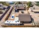 Backyard aerial view features RV, boat, trampoline, detached garage and covered patio at 2031 S Cactus Rd, Apache Junction, AZ 85119