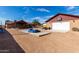 Large backyard with a detached garage, covered patio, and expansive space for outdoor activities and entertainment at 2031 S Cactus Rd, Apache Junction, AZ 85119