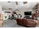 Spacious finished basement with a home gym, comfortable seating, and a large television at 2031 S Cactus Rd, Apache Junction, AZ 85119