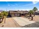 Well-maintained single-story home featuring low-maintenance landscaping and a wide driveway at 2031 S Cactus Rd, Apache Junction, AZ 85119