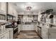 Stylish kitchen featuring granite countertops, stainless appliances, and a cozy breakfast nook at 2031 S Cactus Rd, Apache Junction, AZ 85119