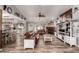 Spacious living room with a fireplace, leather sofas, and views into the modern open kitchen at 2031 S Cactus Rd, Apache Junction, AZ 85119