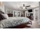 Spacious main bedroom with neutral tones, ceiling fan, and french doors to outside at 2031 S Cactus Rd, Apache Junction, AZ 85119