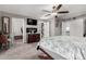 Cozy main bedroom featuring a ceiling fan, television, and closet access at 2031 S Cactus Rd, Apache Junction, AZ 85119