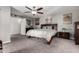 Bright and airy main bedroom with ensuite bathroom and large window overlooking the yard at 2031 S Cactus Rd, Apache Junction, AZ 85119