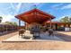 Expansive covered outdoor patio features grill, seating, and entertainment area for relaxation at 2031 S Cactus Rd, Apache Junction, AZ 85119