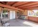 Inviting covered porch featuring comfortable seating, a small table, and decorative elements at 2031 S Cactus Rd, Apache Junction, AZ 85119